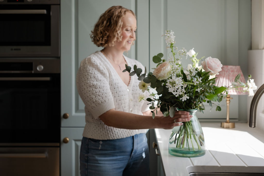 Designer arranging flowers