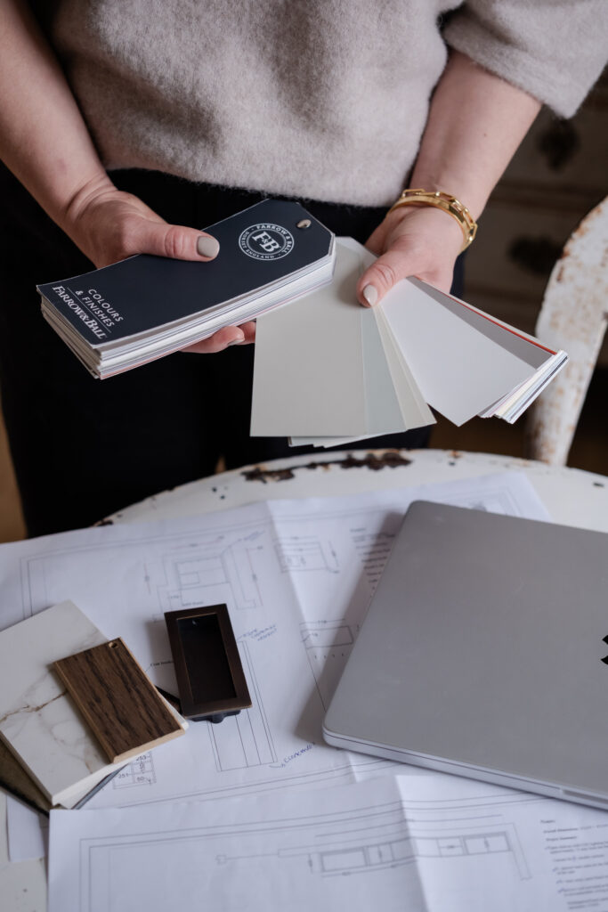 designer holding colour charts