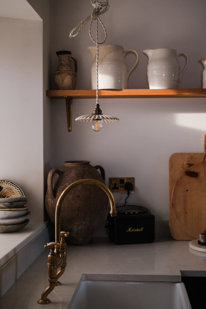 Kitchen detail with tap and pendant light