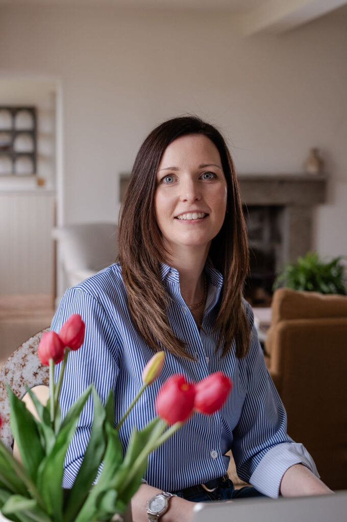 headshot of nutritionist with tulips
