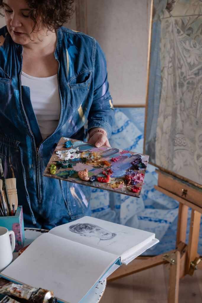 female artist with paint palette