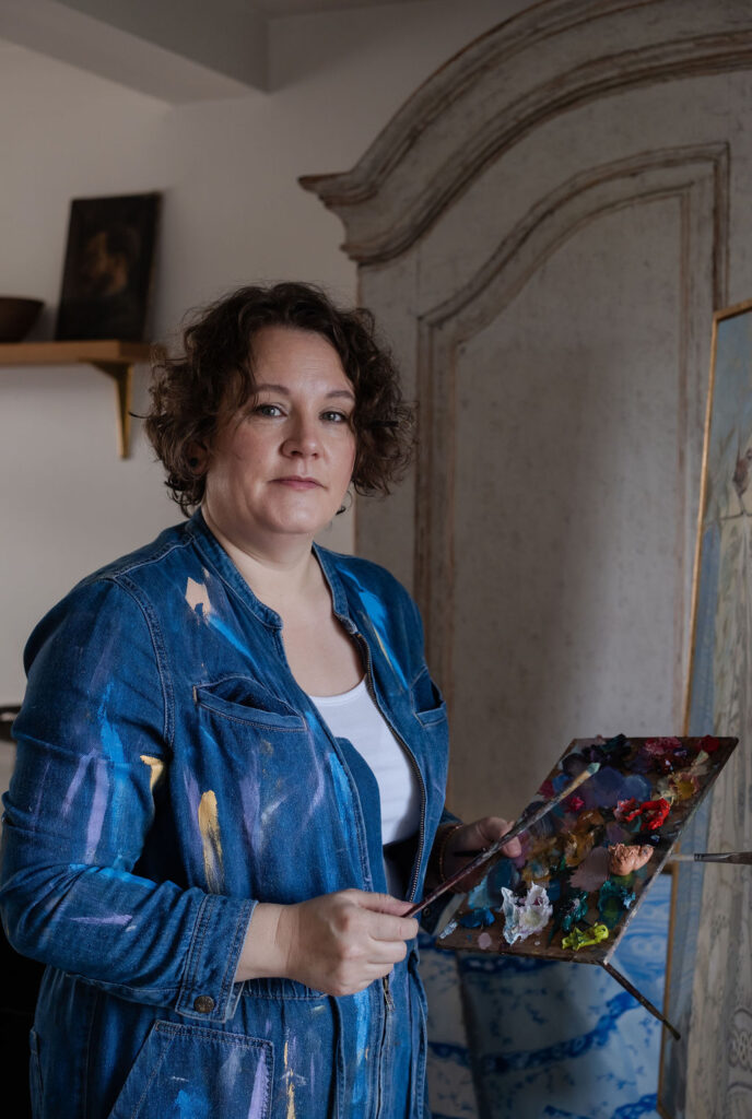 female artist with painting