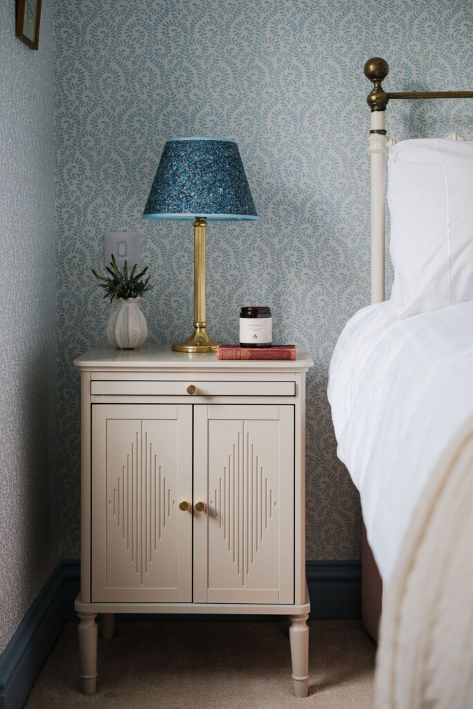Luxury holiday home bedroom with bedside styling